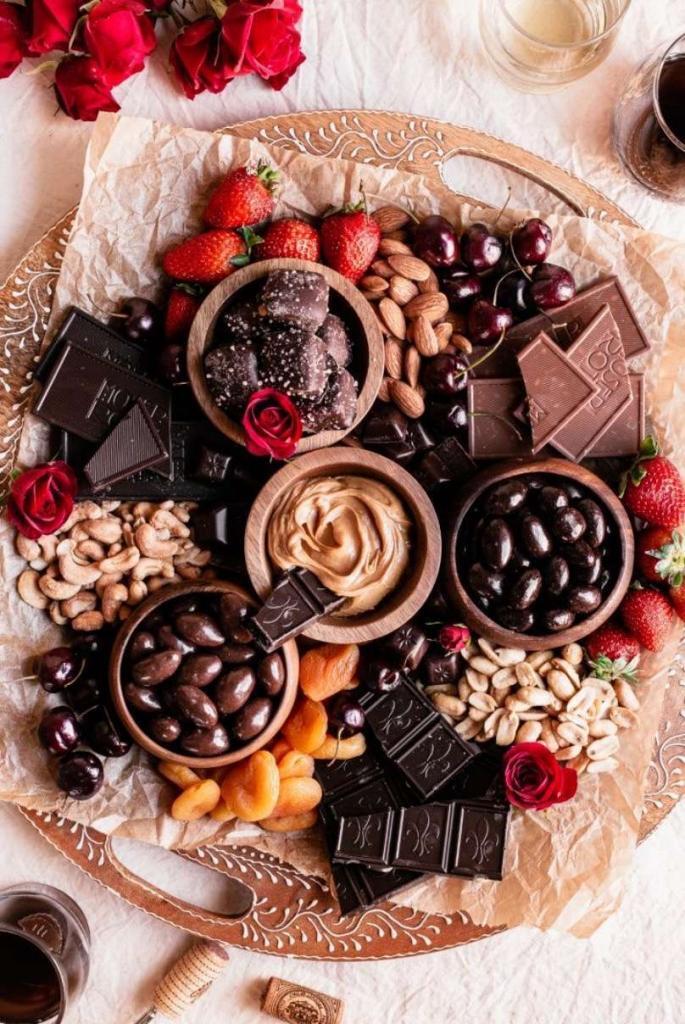 Desert board loaded with chocolate and sweets.